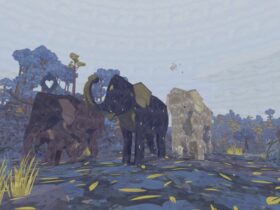 Three elephants surrounded by blue trees